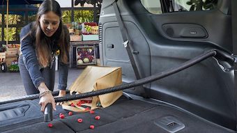 woman vacuuming in the back of the 2020 Chrysler Pacifica