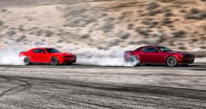 Two 2021 Dodge Challengers racing.